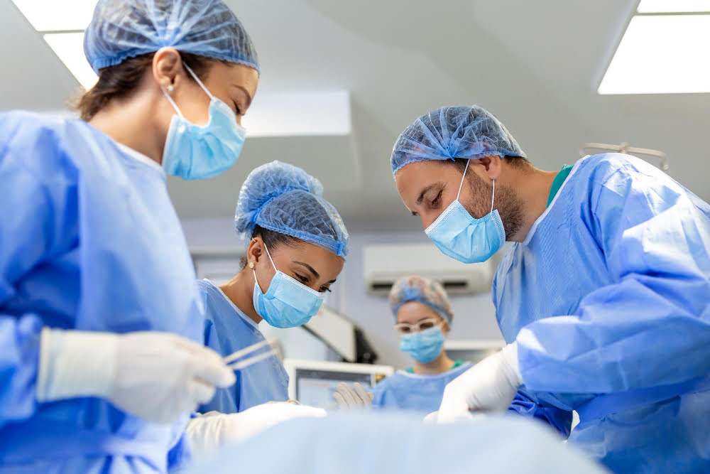 Group of Doctors doing surgery